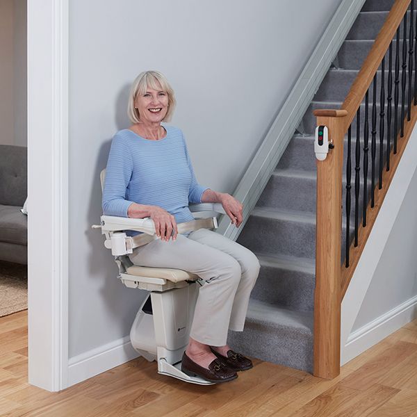 1100-straight-stairlift-woman-in-use Handicare Straight Stairlift 1100