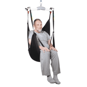 Handicare ComfortCare Spacer Sling on hoist for elderly home care and mobility support.
