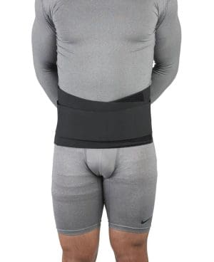 OTC 2886 Sacro Brace, adjustable lumbar support for home care mobility, worn by model.