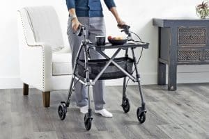 Stander Wonder Indoor Rollator with tray for home mobility support and safe food transport.