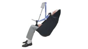 Elderly man in Arjo Clip Sling MAA2000M patient lift for safe home mobility transfers.