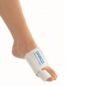 OTC Toe Alignment Splint 8710 on bare foot, supports big toe for home correction.