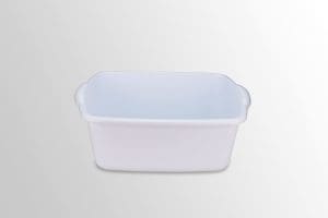 White medical plastic wash basin with handles, ideal for home care and patient mobility support.