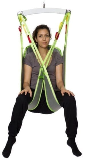 HumanCare Sit Sling for mobility support; woman seated, ideal for home care patient transfers.