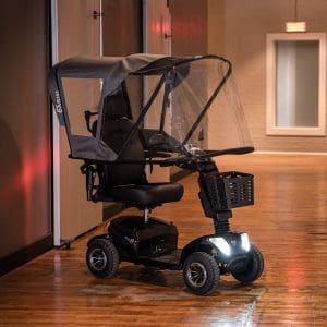 MOVO MV-100-2 mobility scooter with canopy and basket for indoor mobility support.